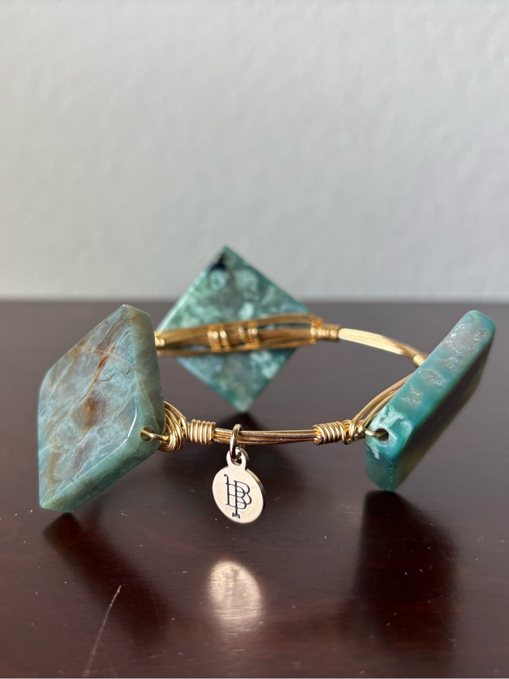Pair of Bourbon and Bowtie gold bracelets